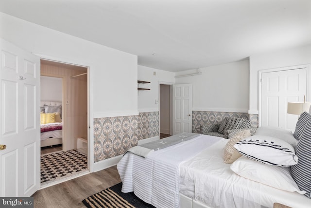 bedroom with wood-type flooring