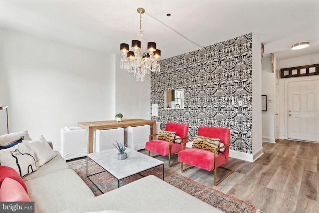 living room with a notable chandelier and hardwood / wood-style flooring