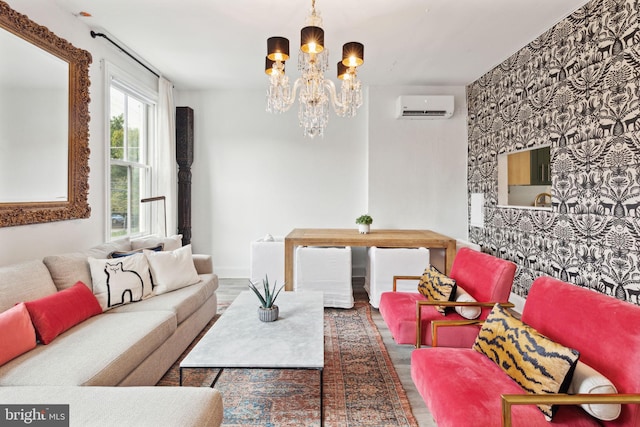 living room featuring a chandelier, hardwood / wood-style flooring, and a wall mounted air conditioner