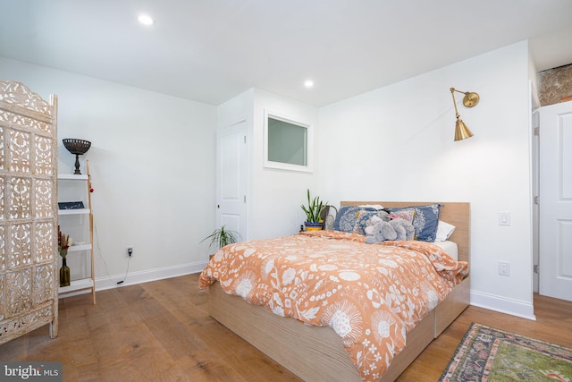 bedroom featuring hardwood / wood-style flooring