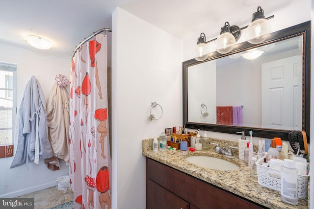 bathroom with tile patterned flooring and vanity