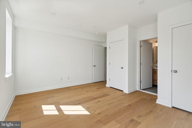 unfurnished bedroom featuring light wood-type flooring