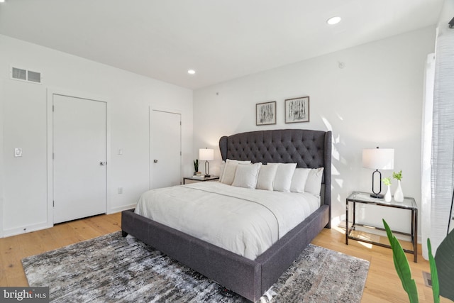 bedroom with wood-type flooring