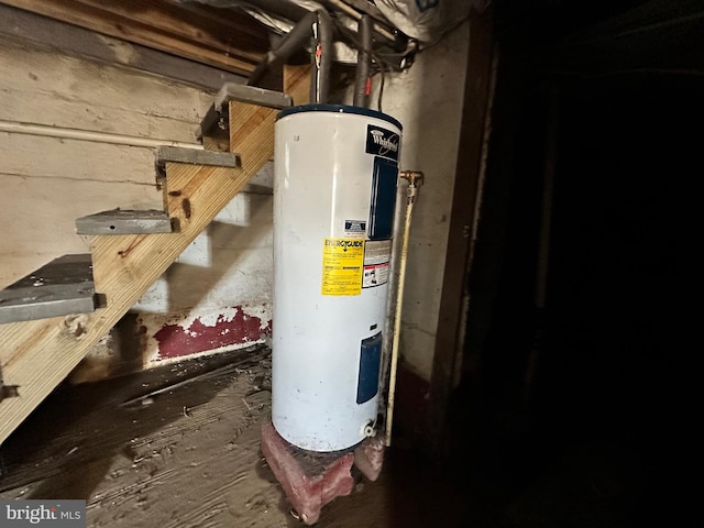 utility room featuring electric water heater