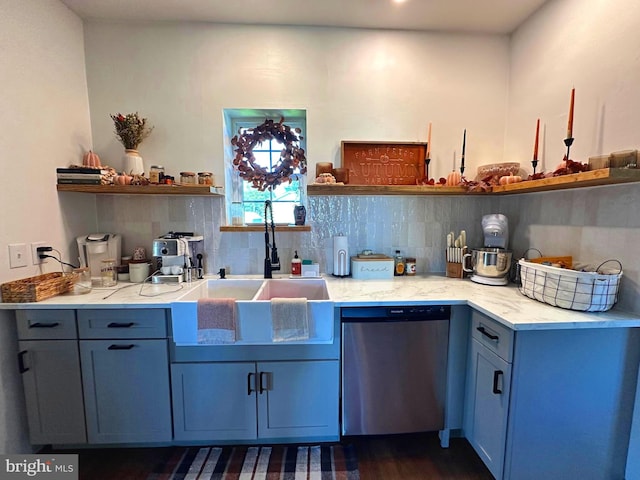 kitchen featuring dishwasher, dark hardwood / wood-style floors, tasteful backsplash, and sink