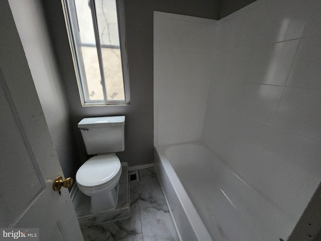 bathroom featuring separate shower and tub and toilet