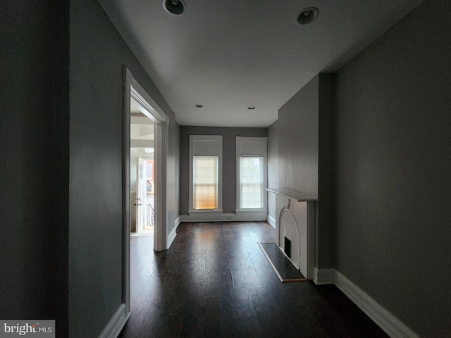 corridor with dark wood-type flooring