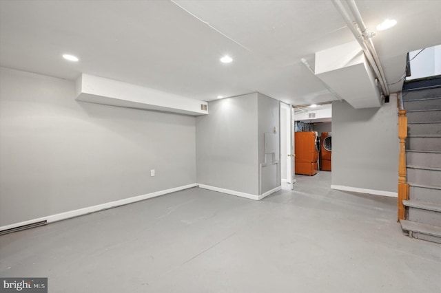 basement with washing machine and clothes dryer