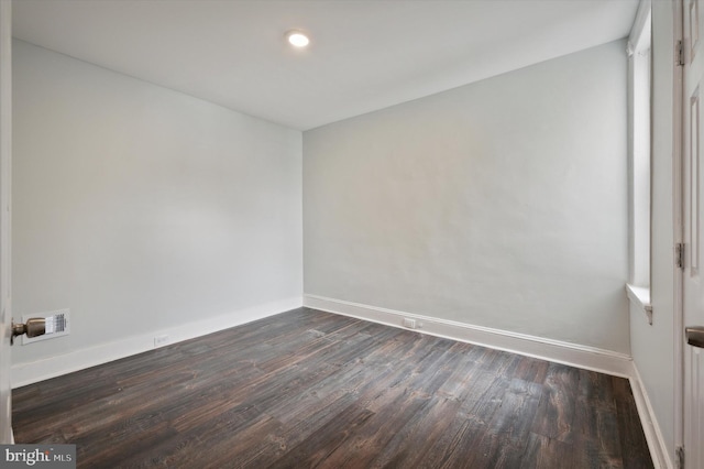 empty room featuring dark hardwood / wood-style floors