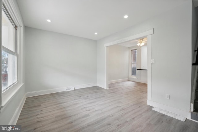 spare room featuring ceiling fan and light hardwood / wood-style floors