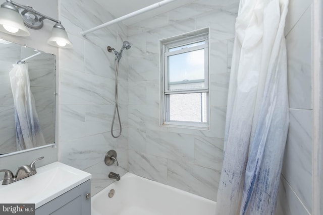 bathroom with shower / bathtub combination with curtain and vanity