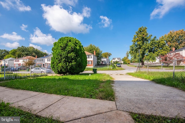 view of property's community with a yard