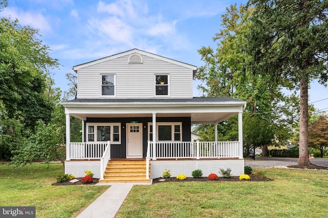 farmhouse featuring a front lawn and covered porch