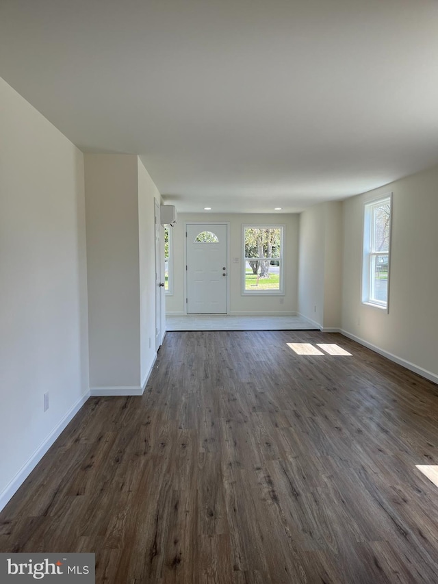 foyer entrance with dark hardwood / wood-style floors