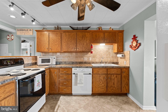 kitchen featuring white appliances, crown molding, track lighting, ceiling fan, and sink