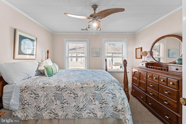 bedroom featuring carpet floors, crown molding, and ceiling fan