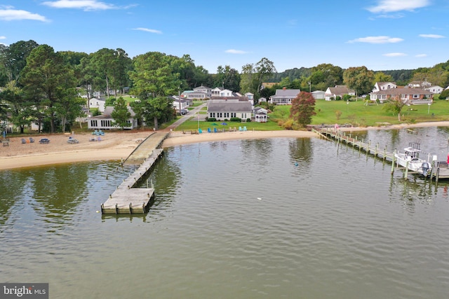 exterior space with a lawn and a water view