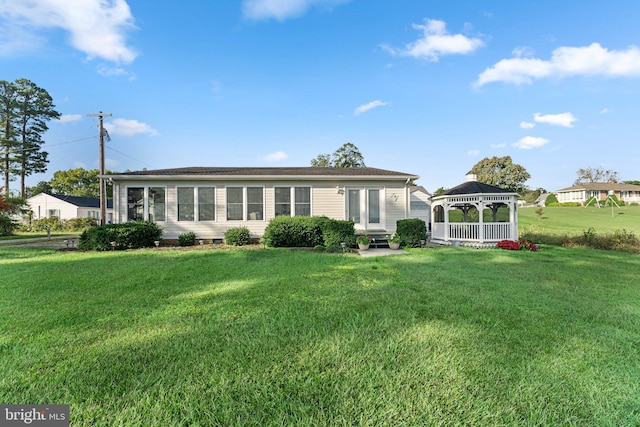 ranch-style house featuring a gazebo and a front lawn