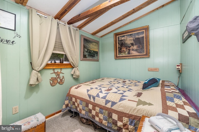 bedroom featuring vaulted ceiling with beams, wood walls, and carpet flooring