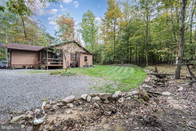 view of yard featuring a wooden deck