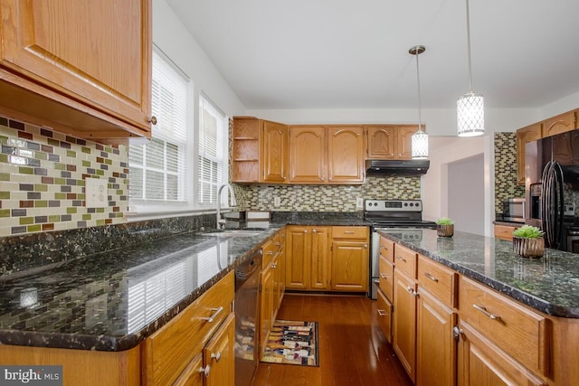 kitchen with appliances with stainless steel finishes, dark wood-type flooring, backsplash, decorative light fixtures, and sink