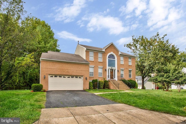 view of front facade with a front lawn and a garage