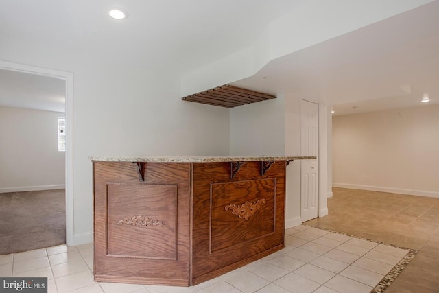 bar with light tile patterned flooring