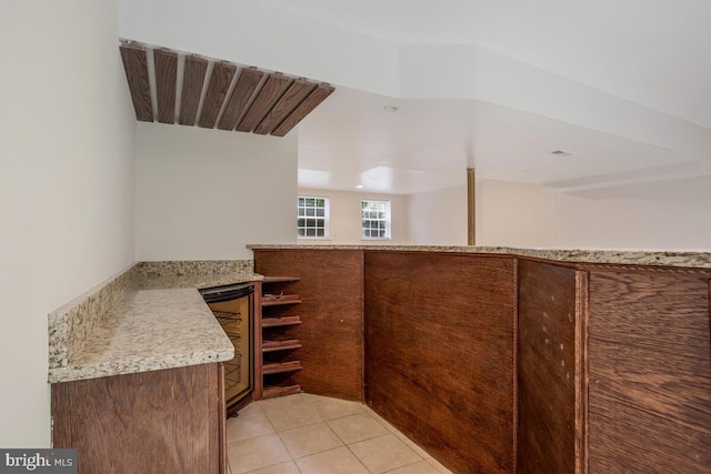 bathroom featuring wine cooler and tile patterned floors