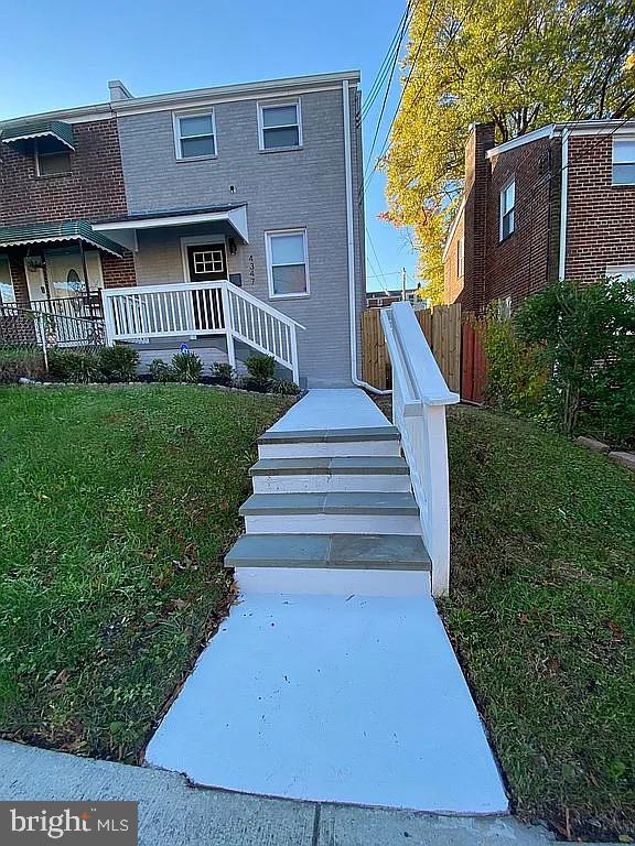 exterior space with a yard and a porch