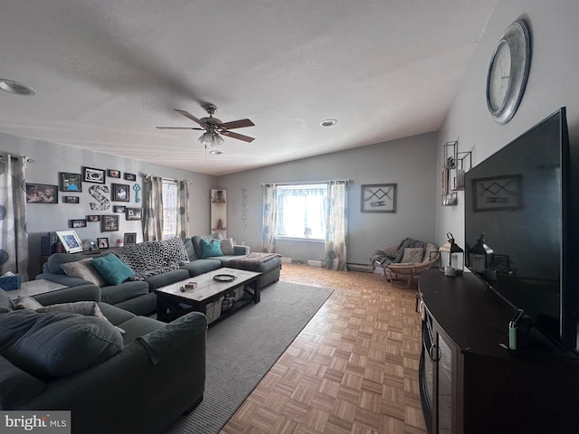 living room featuring parquet flooring, a textured ceiling, and ceiling fan