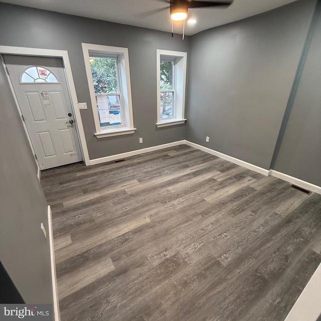 entrance foyer featuring dark wood-type flooring and ceiling fan