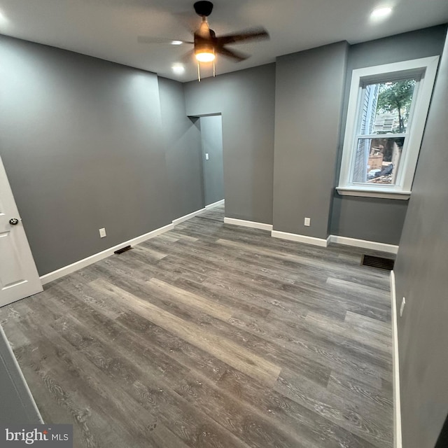 unfurnished room with wood-type flooring and ceiling fan