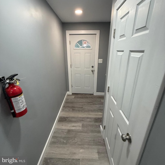 doorway to outside with dark wood-type flooring