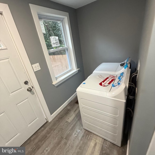 laundry room featuring washer / dryer and dark hardwood / wood-style floors