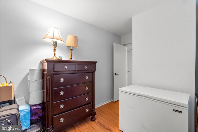 washroom with light hardwood / wood-style floors