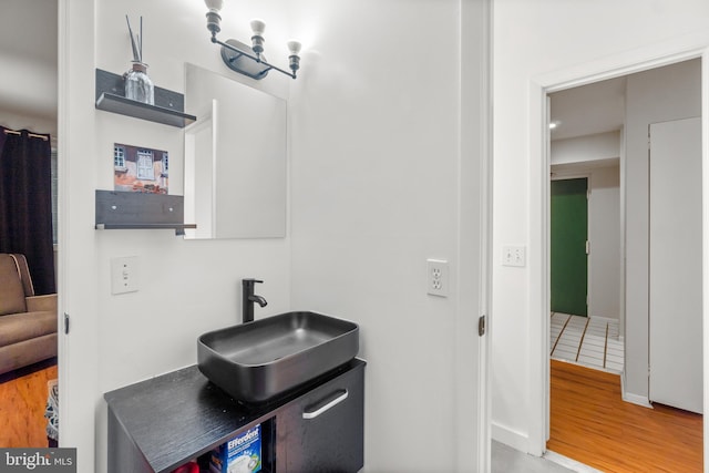 bathroom featuring vanity and hardwood / wood-style floors