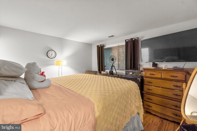 bedroom with wood-type flooring