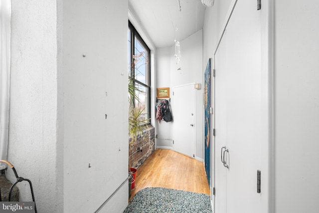 corridor featuring hardwood / wood-style floors