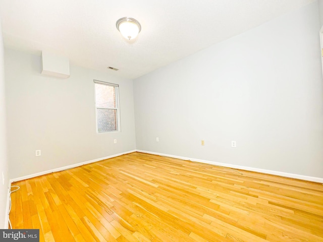 unfurnished room featuring wood-type flooring