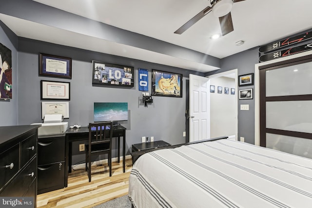 bedroom featuring ceiling fan and light hardwood / wood-style flooring