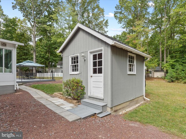 view of outdoor structure with a lawn