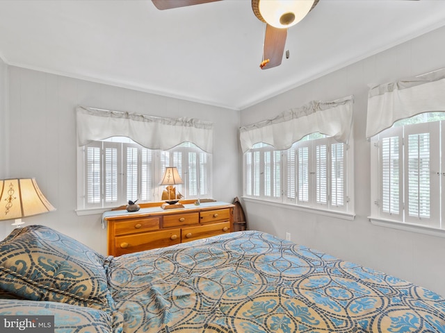 bedroom with crown molding and ceiling fan