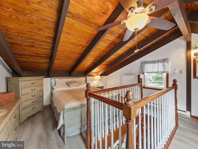 unfurnished bedroom featuring ceiling fan, vaulted ceiling with beams, wood ceiling, and light hardwood / wood-style floors