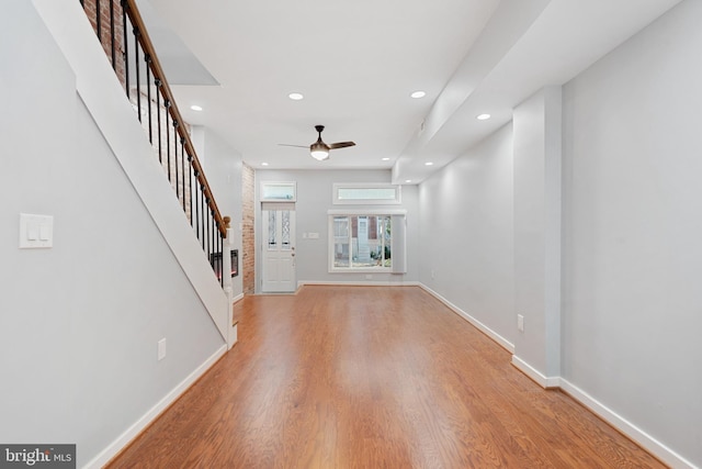 entryway with hardwood / wood-style floors and ceiling fan