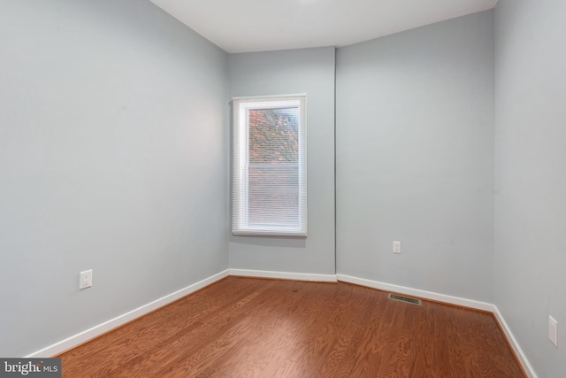 unfurnished room featuring hardwood / wood-style floors