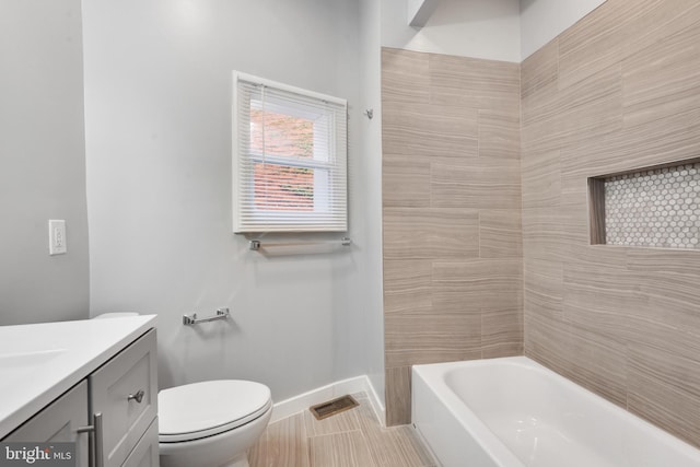 bathroom featuring vanity, toilet, and tile patterned floors