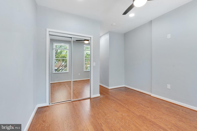 empty room with light hardwood / wood-style floors and ceiling fan