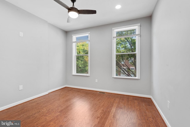 spare room featuring ceiling fan and wood-type flooring