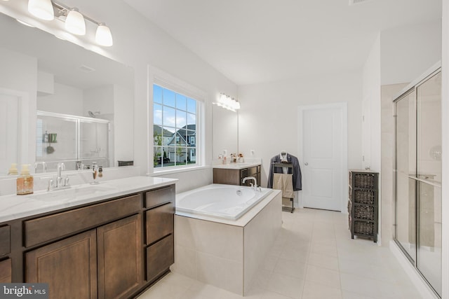 bathroom featuring vanity, shower with separate bathtub, and tile patterned flooring