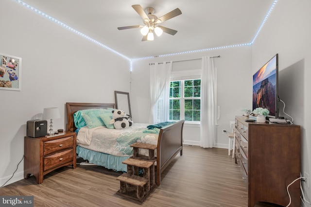 bedroom featuring hardwood / wood-style floors and ceiling fan